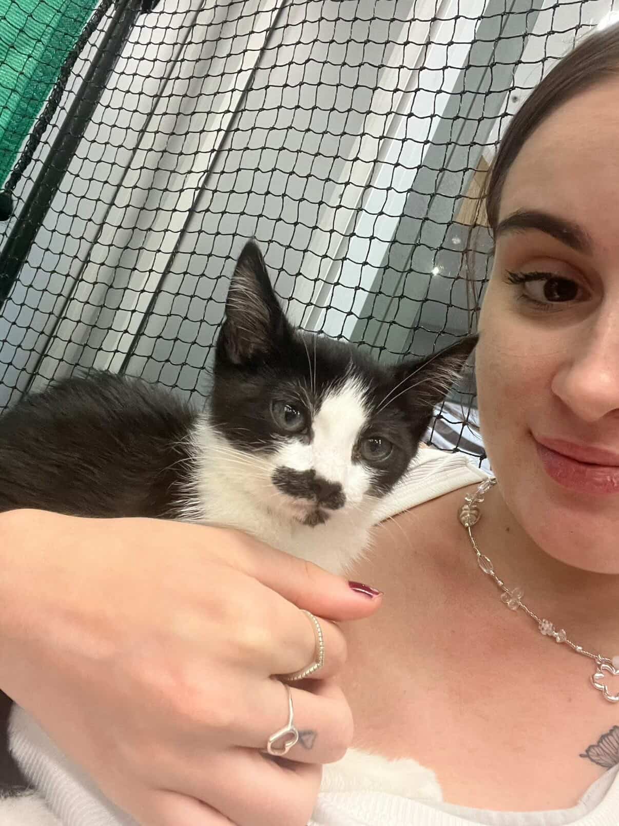 Zoe from Tides and Strides with a cat