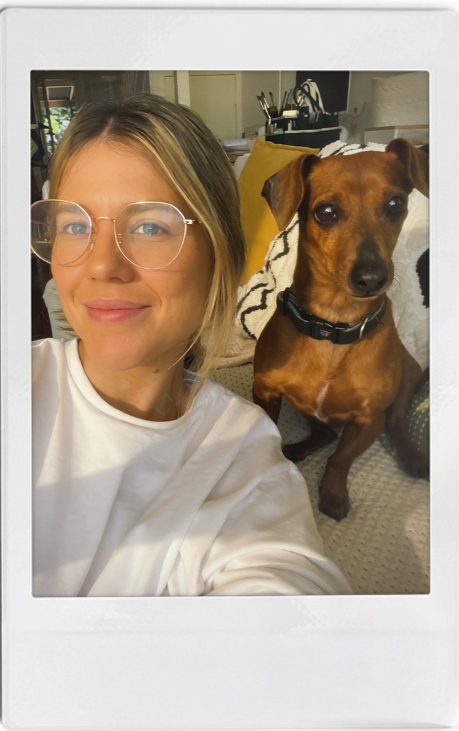 Ash with a dachshund during a stay