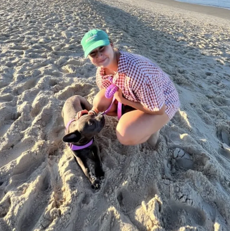 Makayla at the beach with a French Bulldog